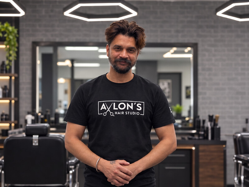 Gourav, barber at Avlon's Hair Studio, in the shop