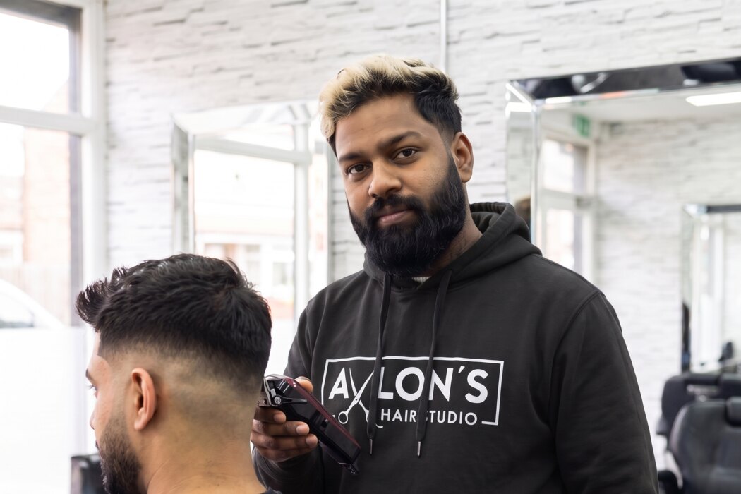 Reagan cutting a skin fade inside the shop